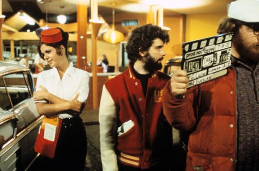 The outfits worn by the carhops in the film (including roller skates) were not typical garb for the Mels employees.