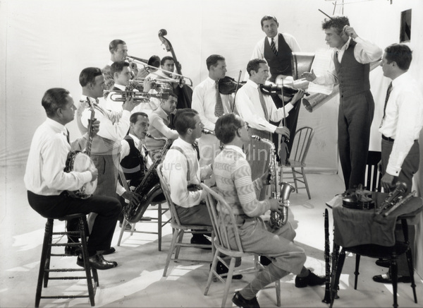 Charlie Chaplin conducting the Abe Lyman Orchestra. With the Lyman Orchestra Chaplin recorded two of his earliest records, ‘Sing a Song’ and ‘With You, Dear, In Bombay,’ both later used in the sound version of City Lights.