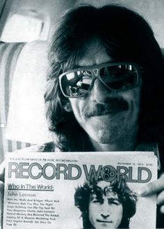 George Harrison displays the November 18, 1974 edition of Record World featuring a fellow named John Lennon on the cover.