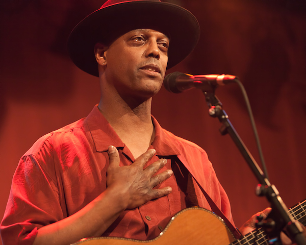 Eric Bibb: nudging listeners toward the path of racial harmony by reminding them of the ugly past and the redemptive major accomplishments that emerged from it, with work still left to do.