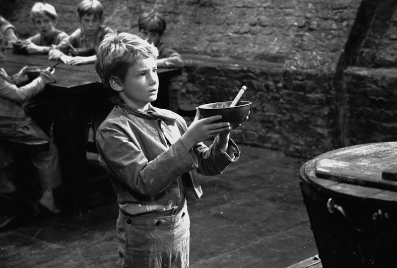 Poor orphan Oliver Twist was one of the 989 named characters Dickens created during his prolific career. Above, Mark Lester asks for more gruel during the 1967 filming of Oliver!