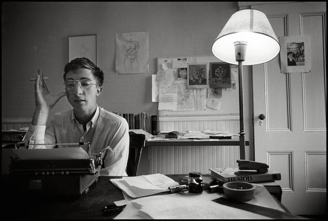 A young John Updike writing in his office. (Photo: Ipswich.wordpress.com)